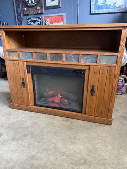 Fireplace entertainment center with built in space heater