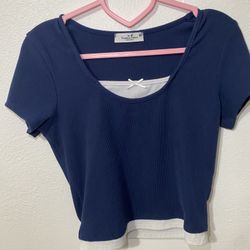 Navy blue crop top with white bow detail  SIZE M