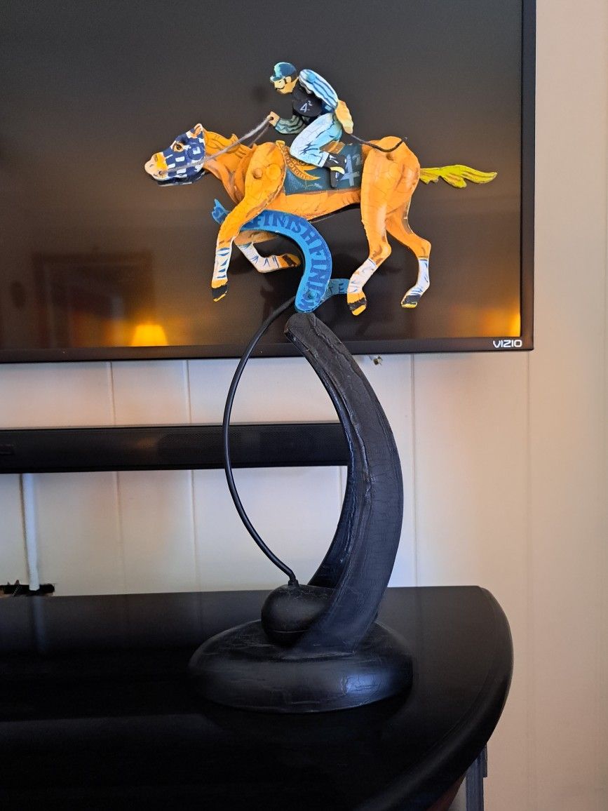 18 1/2 in tall horse jockey figurine that gallops when you push it (like a pendulum).