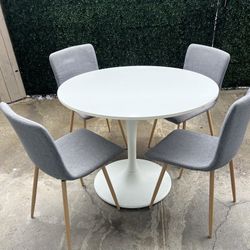 Dining Table and 4 Chairs Round White  Ikea Docksta Grey Fabric Chairs