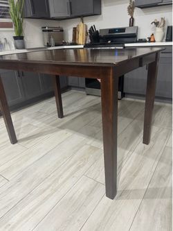 Dining table - counter height wood brown