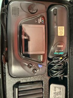 Sega game gear console with games and accessories
