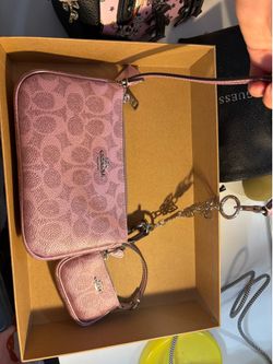 pink coach with its keychain