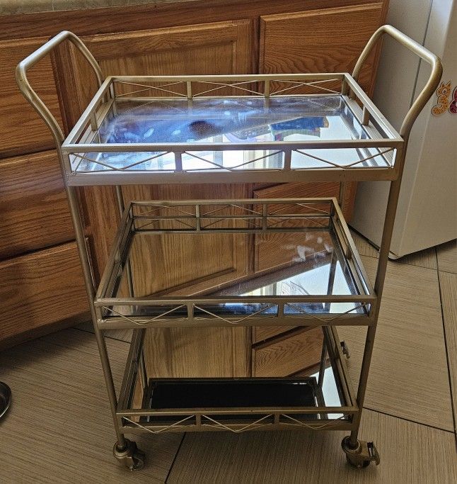 Gold Metal 3 Tiered Cart With Mirrored Shelves. $25.
