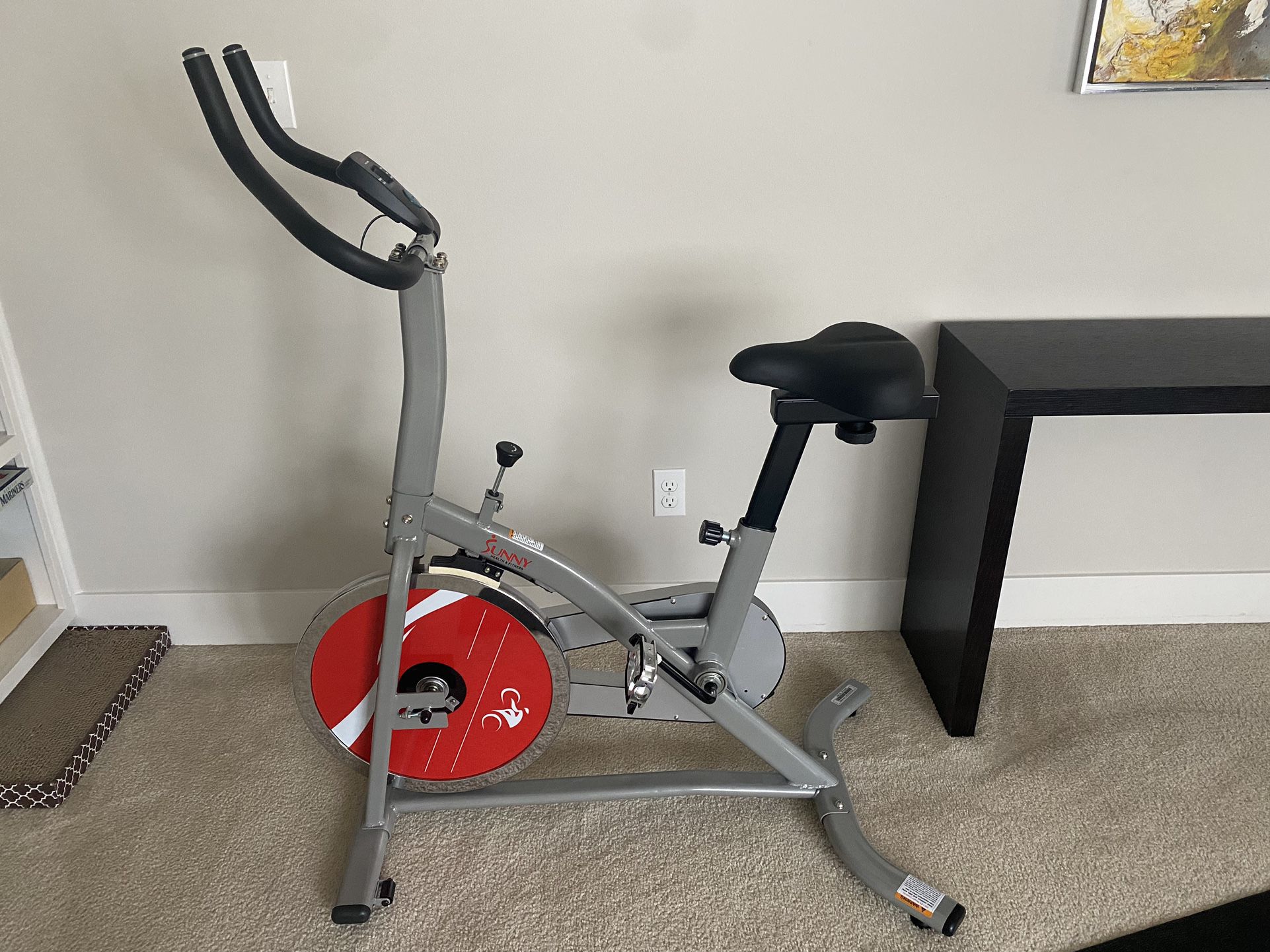 Sunny Health & Fitness Indoor Cycling Resistance Exercise Bike w/Optional Dumbbell Holder & Connected Fitness
