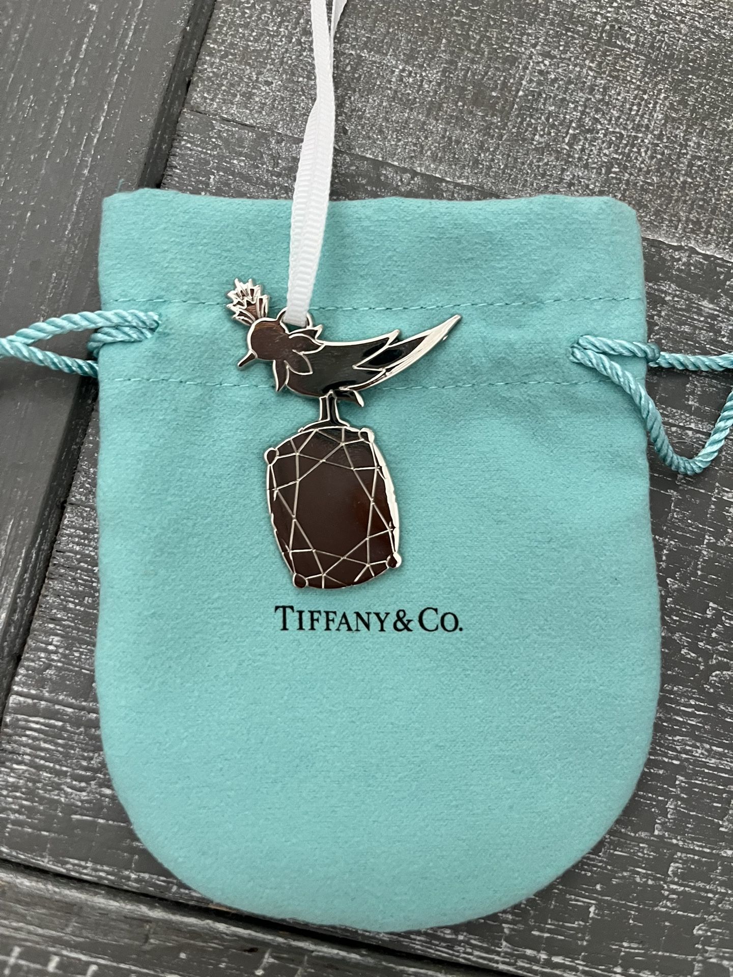 Authentic Tiffany & Co bird on the rock charm with a pouch