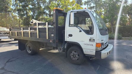 2005 NPR 12 foot stake bed truck