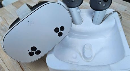 Meta Quest 3S VR headset with white controllers