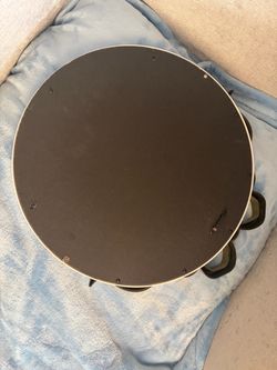 Mirror with the white around and a gold bow on top