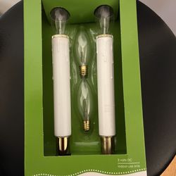 Two battery operated candle, lamps clear