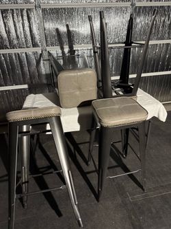Four (4) industrial-style counter/bar stools