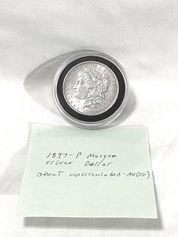 About uncirculated sealed in capsule 1897-P Morgan Silver Dollar. Value at $112 on US coin book.