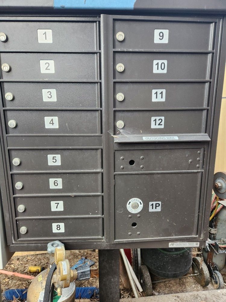 Used Working Condition: Cluster 12× slot Mailbox with Stand.