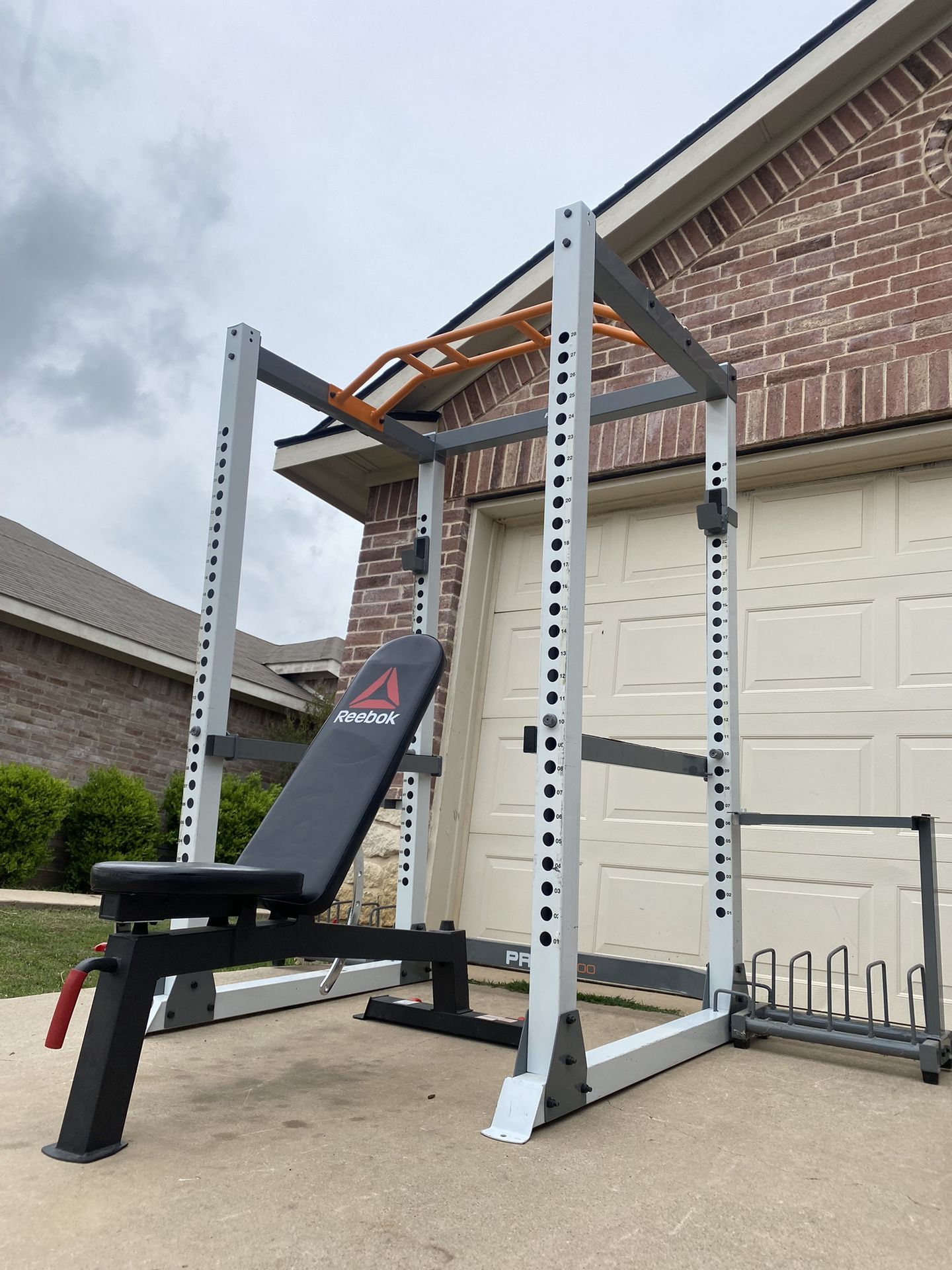 power rack  and adjustable bench (comes with weight and kettlebells  storage racks )