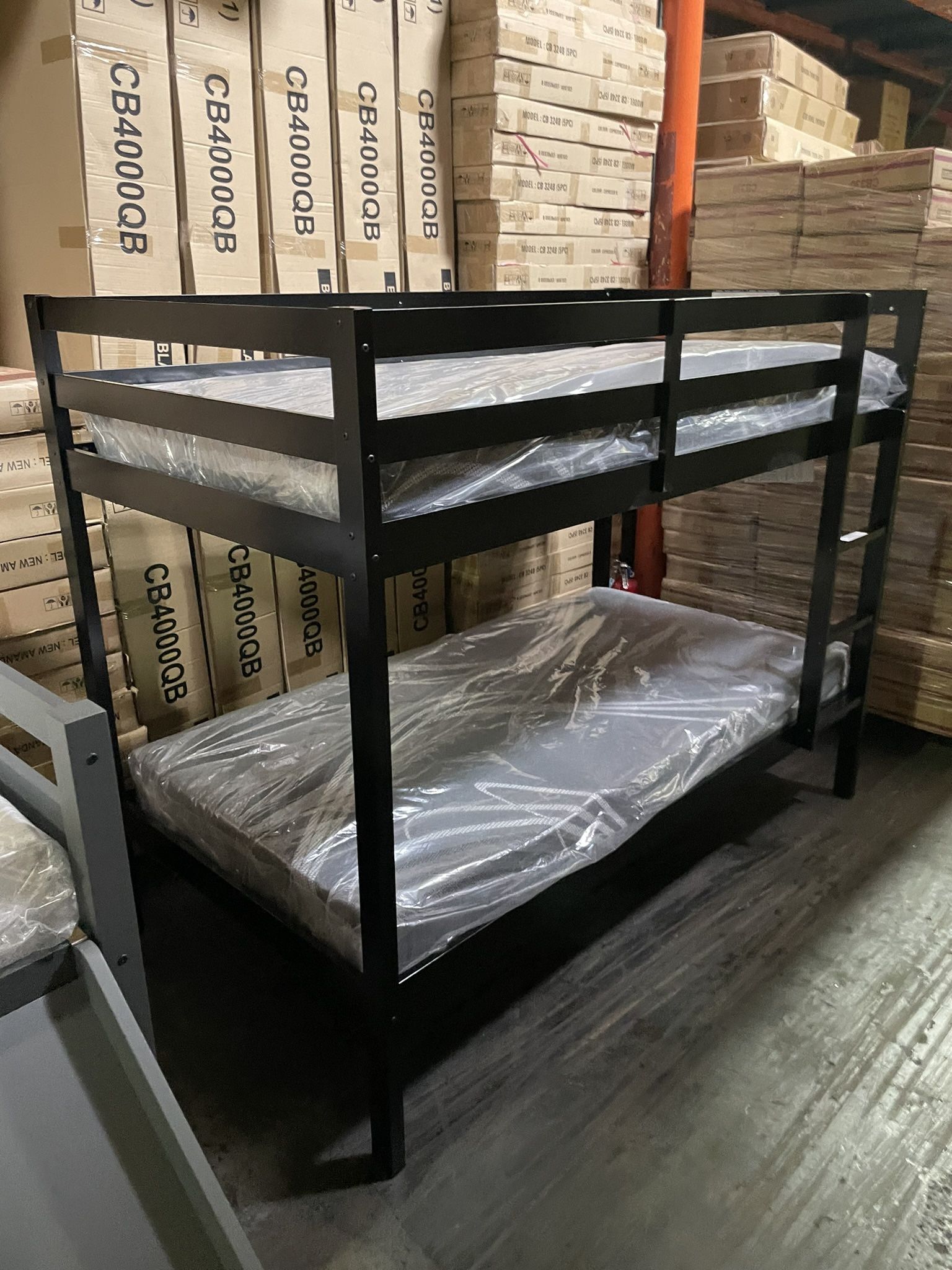 Twin bunk bed. Available in espresso, white, & grey. Bunk bed only-$220. With mattresses-$399. Assembly required. Assembly not included. Tax included.