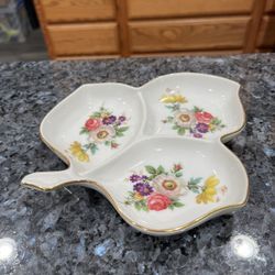 Dish with Flowers. Size approximately 7 1/2 inches long. Has been on display in a curio cabinet. Smoke free home