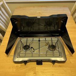 Coleman Triton series camping stove. Two Burner Propane.  Almost New Condition.  Hardly Used.