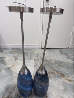 pair of pendant lights (also called hanging pendant lamps). The shades is like be hand-blown blue art glass with a brushed nickel finish.