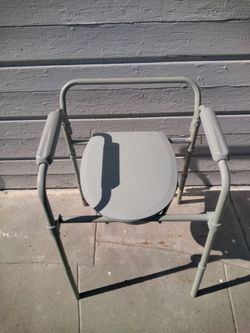 Bedside commode And Raised Toilet Seat With Bucket Is Height Adjustable Supports 350 Pounds.
