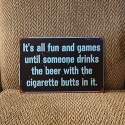 FUN AND GAMES METAL SIGN.  12" X 8".  NEW. PICKUP ONLY 