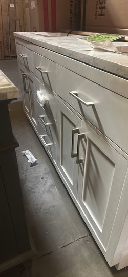 Bathroom van is double sink 6 foot long with a marble top