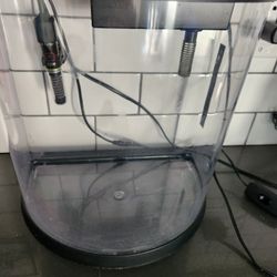 3.5 gallon Bowfront Fish Tank with extra filter cartridges.