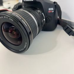 Canon Rebel T7 DSLR BODY W/CAMERA BAG AND ZOOM LENS