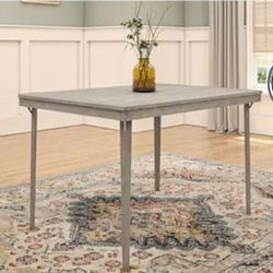 COSCO wooden folding dining table in 'grey wood pattern' (Gray Woodgrain).
There are two tables avai