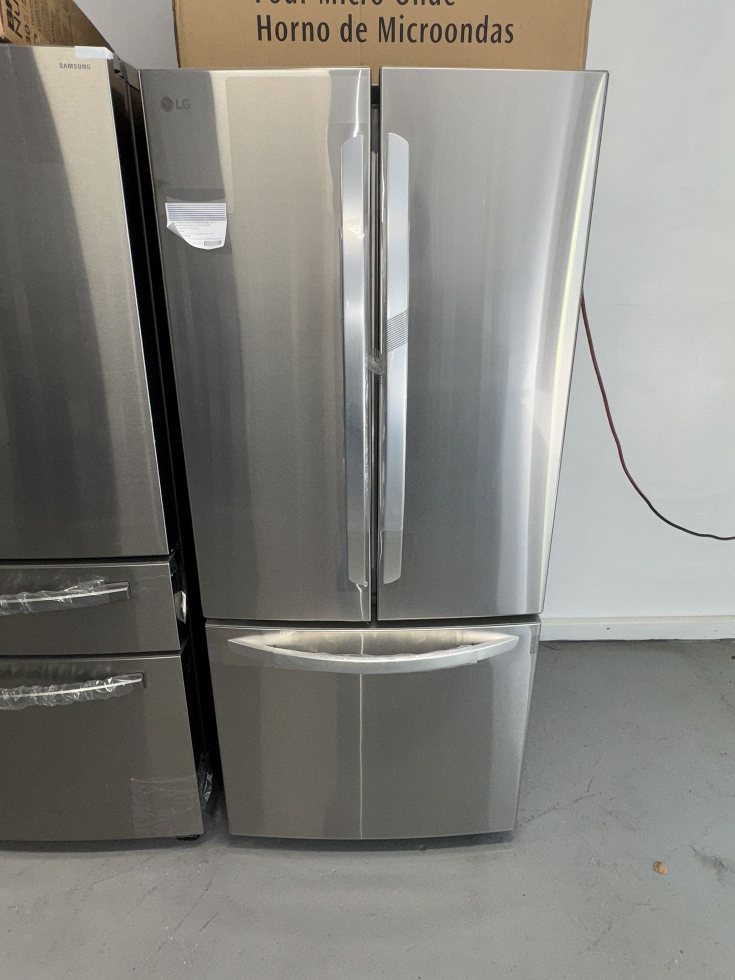 LG new stainless steel refrigerator, new 22 cubic feet