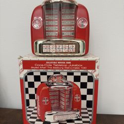 Vintage Coca Cola Tabletop Jukebox Musical Bank 1996  In good condition, comes with original box -Tested and working - requires 3 AA batteries, and yo