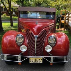 1938 Ford woody with a 350 Chevy clock stickshift, 2004 trailer sleeper. 