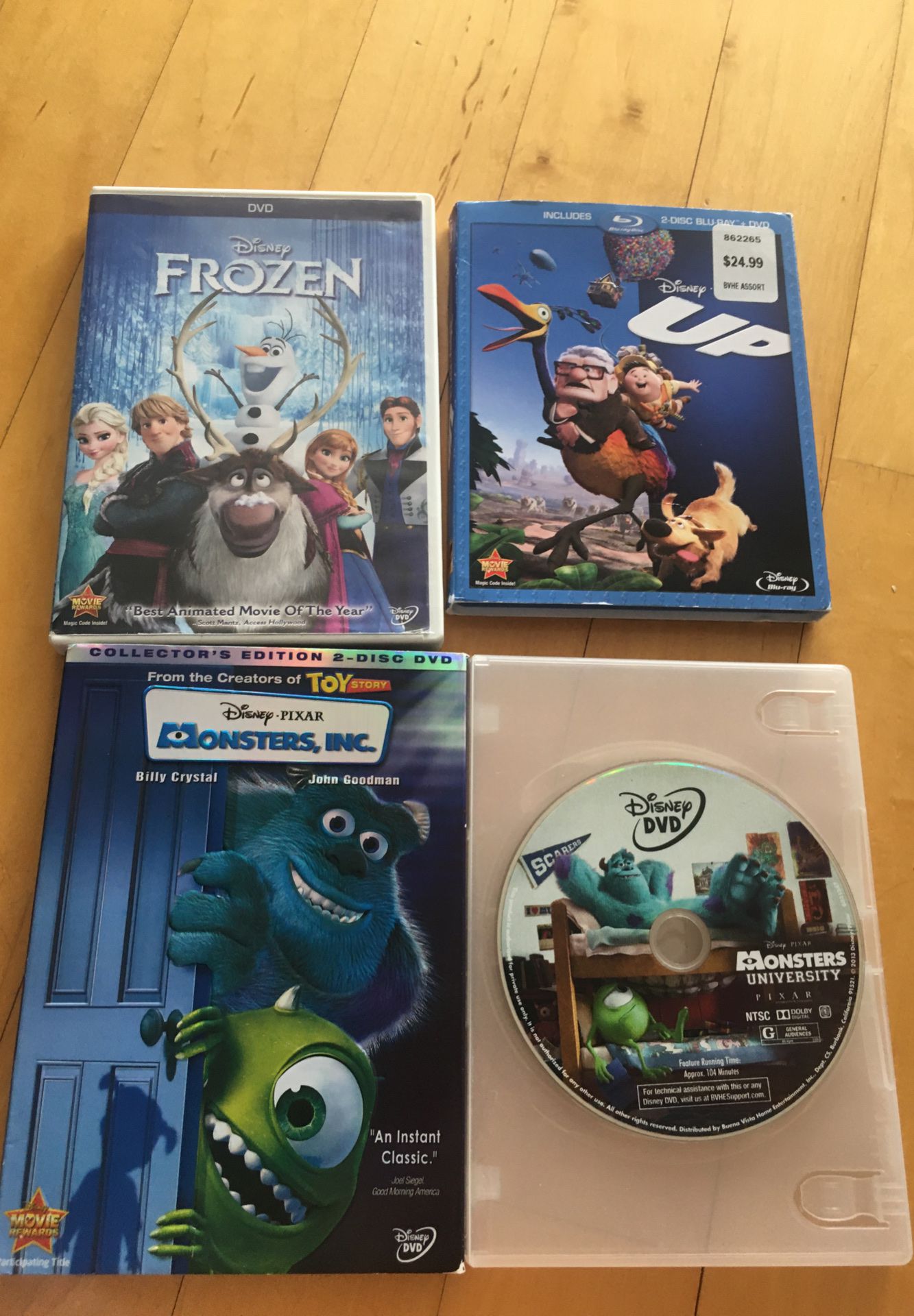 DVD of Up, Monsters Inc. , Monsters University and Frozen.