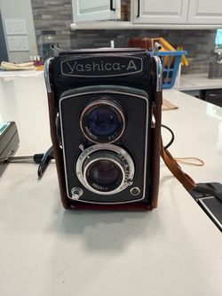 Vintage Camera Collector Yashica‑A,