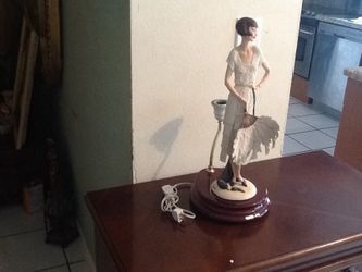 figurine with a lamp made by Armani