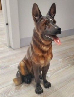 Porcelain figurine of a German Shepard.