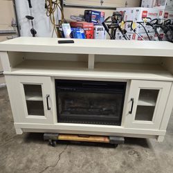 Fireplace TV Stand 
Great Condition 
Everything Works 
H- 33"
L-54"
W- 15.5/8"
$175