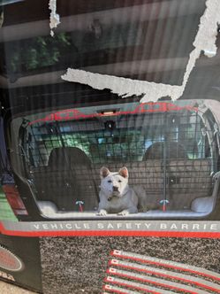 Dog barrier for vehicles