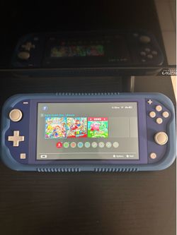 Nintendo switch lite + mario odyssey and super smash bros