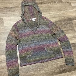 Multicolor striped knit hoodie likely made from a wool or acrylic blend, featuring a front kangaroo pocket and a v-neck with a hood