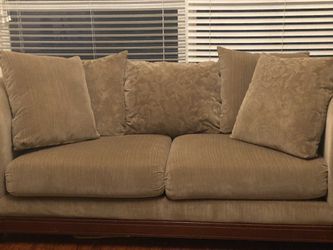 Sage Green Couch With Cherry Wood Feet And Accents 