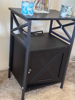 Black nightstand with Outlet port