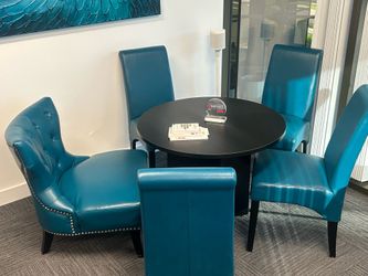 Black round table and four chairs really fun color