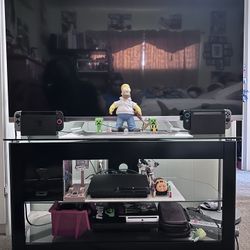 TV with stand and PS3 with games.