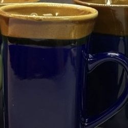 Beautiful tall Royal Norfolk stoneware coffee or tea mugs with Blue body and a brown rim. Made of Stoneware Two-toned with a square base. Dishwasher a
