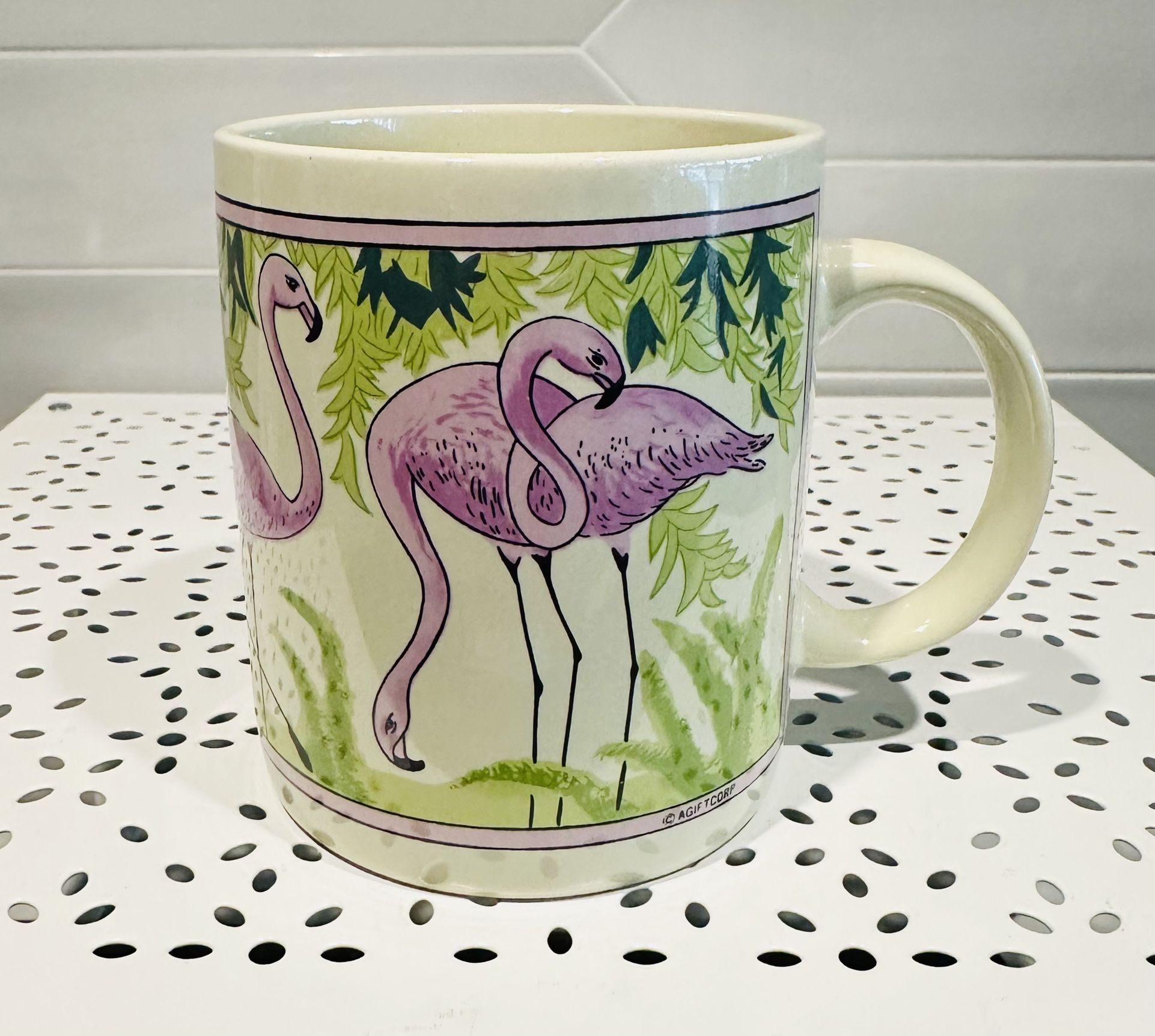 Vintage flamingos coffee mug. 12 oz. 4” tall. Tropical design with parrot on the back side.