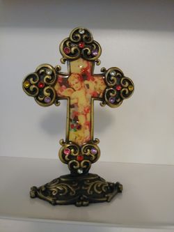 Beautiful figurine/statue of a cross with cherub