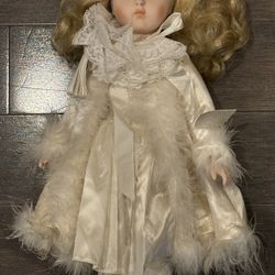 TWO VINTAGE ANTIQUE DOLLS ONE MUSICAL