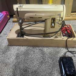 Vintage Singer sewing machine, Collectible Nice piece of machinery. Works just fine. Next