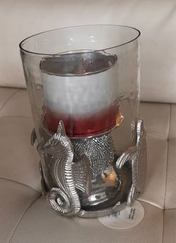 Elegant hurricane glass candle holder with turtle accents