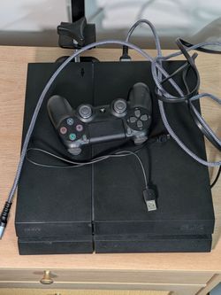 PlayStation 4 with controller, HDMI cable and power cord